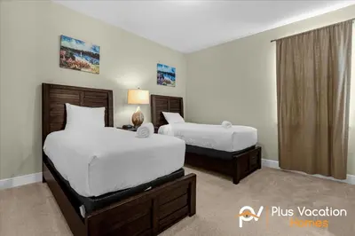a bedroom with two beds and a window at 561 - 8BD Villa - Private PoolSpa by Disney in Orlando