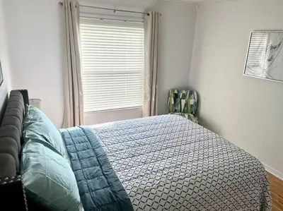 a bedroom with a bed and a window at Dreamy Family Pool House in Clermont