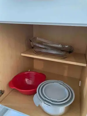 a cabinet with a red bowl and plates on a shelf at Florida Suburban Oasis ~ Lk Mary/Sanford Florida! in Sanford