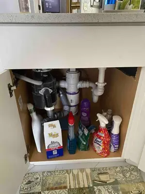 a cabinet under a sink with cleaning products under it at Florida Suburban Oasis ~ Lk Mary/Sanford Florida! in Sanford
