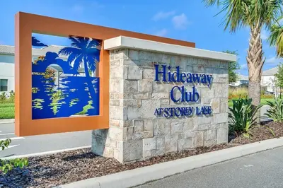 a sign for a life away club accessory king at Resort Life at Storey Lake by Shine Villas, #702 apts in Kissimmee