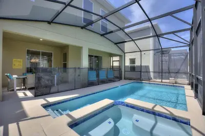 an indoor swimming pool with a glass ceiling at Stars Align Storey Lake by Shine Villas villa in Kissimmee