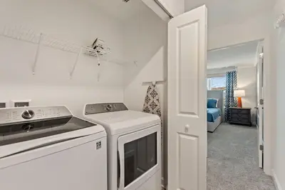 a kitchen with a stove and a white appliance at Blue Beach at Storey Lake by Shine Villas #400 townhouse in Kissimmee
