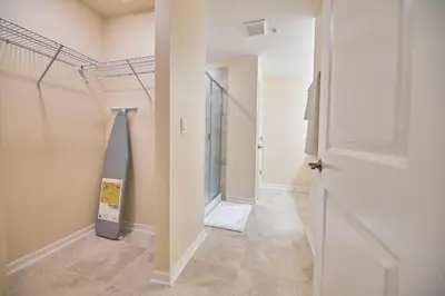 a hallway with a door leading into a room at Vacation Meadows - Storey Lake by Shine Villas 710 apts in Kissimmee