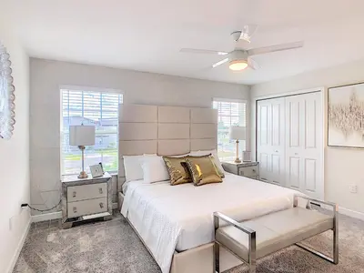 a bedroom with a large white bed and a window at Happy Haven at Storey Lake Resort by Shine Villas condo in Kissimmee