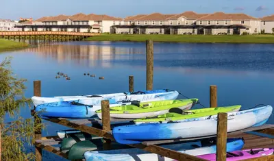 a group of boats sitting in the water at Happy Haven at Storey Lake Resort by Shine Villas condo in Kissimmee