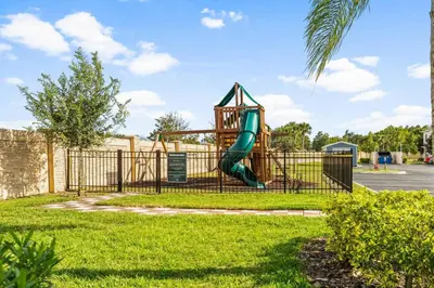 a playground with a slide in a park at Lucky Find Lucaya Resort by Shine Villas #713 townhouse in Kissimmee