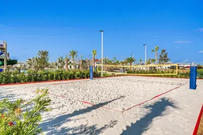 a volleyball court in the sand at a resort at Lake View at Storey Lake by Shine Villas #703 apts in Kissimmee