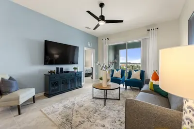 a living room with a couch and a tv at Lake View at Storey Lake by Shine Villas #703 apts in Kissimmee