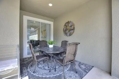 a dining room with a table and chairs at Plush Pelican, at Storey Lake by Shine Villas #839 home in Kissimmee