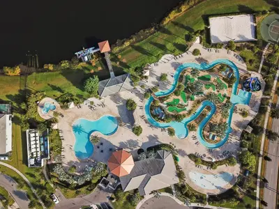 an aerial view of a pool at a resort at Star Hideaway at Storey Lake by Shine Villas townhouse in Kissimmee