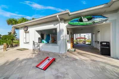 a house with a surfboard on top of it at Star Hideaway at Storey Lake by Shine Villas townhouse in Kissimmee