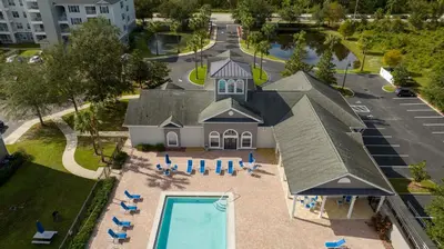 an aerial view of a house with a swimming pool at Your Orlando stay 15 min to Disney - DVH01 in Kissimmee