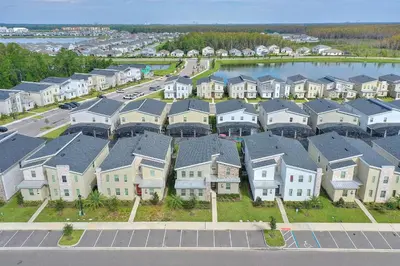 an aerial view of a residential neighborhood with houses at Treat Retreat Storey Lake by Shine Villas #418 villa in Kissimmee