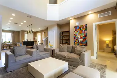 a living room with couches and a coffee table at Gorgeous 4 Bd Close to Disney @ Magic Village 3114 in Orlando