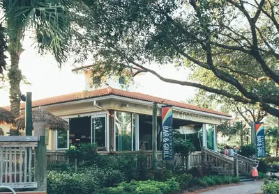 a small house with a porch and a tree at Amazing Private Villa @ Orang Lake Resort in Orlando