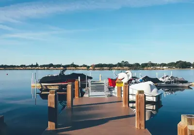 a dock with several boats on the water at Amazing Private Villa @ Orang Lake Resort in Orlando