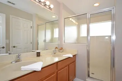 a bathroom with a sink and a shower at Summer Sparkle home in Kissimmee