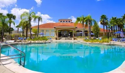 a large swimming pool in front of a resort at Villa Azul townhouse in Kissimmee