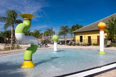 a water fountain in the middle of a swimming pool at California Palms condo in Kissimmee
