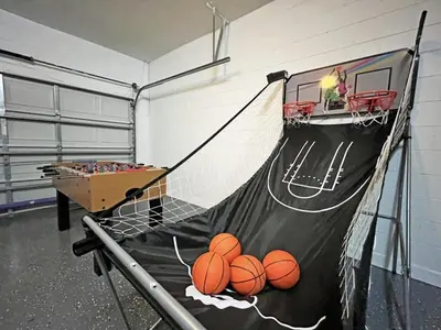 a basketball hoop with balls on it in a gym at Hideaway Dream home in Kissimmee