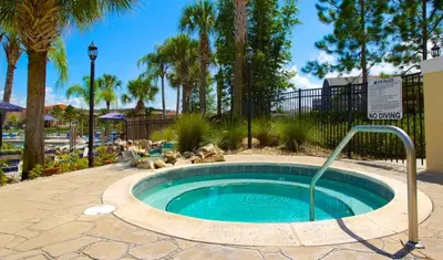 a small swimming pool with teddy bears laying around it at Hideaway Dream home in Kissimmee