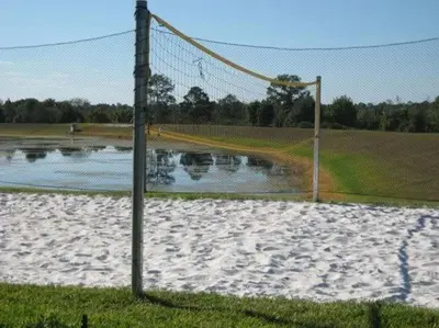 a volleyball net in front of a soccer field at Sunshine Villa villa in Kissimmee