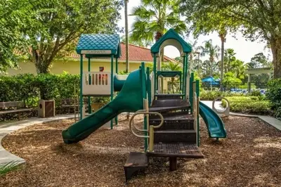 a playground with a slide in a park at Sunshine Villa villa in Kissimmee