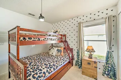 a bedroom with a bunk bed and a window at Clermont Vacation Rental with Pool 11 Mi to Disney in Orlando