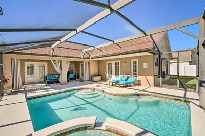 a swimming pool with a patio and a house at Clermont Vacation Rental with Pool 11 Mi to Disney in Orlando