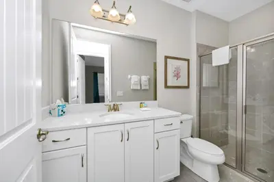 a bathroom with a sink and a toilet and a shower at Alluring Home Near Disney With Themed, Media And Game Room With Waterpark & Resort Access At Encore Resorts Reunion - 232Au in Kissimmee