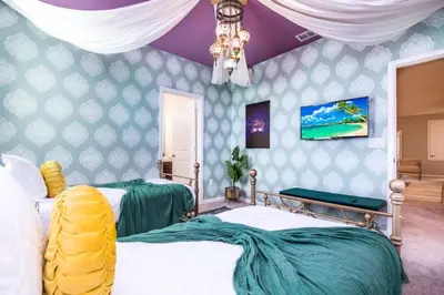 a bedroom with two beds and a purple ceiling at The Ultimate New 15 Bedroom 16 Bathroom Vernada villa in Kissimmee