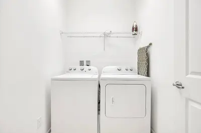 a kitchen with two white refrigerators in a room at 6BR Luxury Home w Pool Hot Tub and Games room in Kissimmee