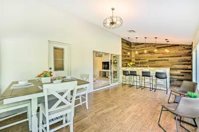 a kitchen and dining room with a table and chairs at Walk to Lake Stunning Central Florida Home! in Lake Mary