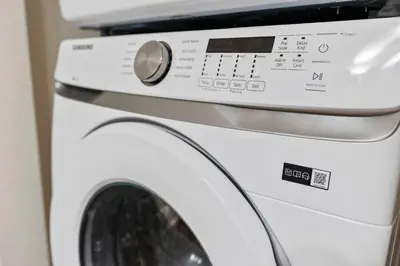 a white washing machine with its door open at Amazing 3 bedrooms At Lucaya- 7 miles from Disney in Kissimmee