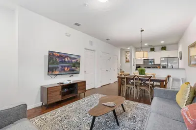 a living room with a couch and a table at Amazing 3 bedrooms At Lucaya- 7 miles from Disney in Kissimmee