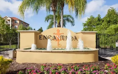 a fountain in front of the entrance to the encore apartments at Amazing 3 Bdrm At Encantada- 6 miles from Disney in Kissimmee