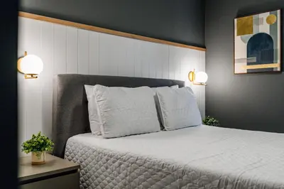 a bedroom with a large bed with two pillows at Amazing 3Bdrms At Encantada -6 miles from Disney in Kissimmee