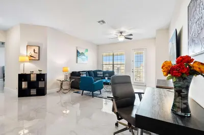 a living room with a couch and a table at 4804 Cayview Avenue 401 in Orlando