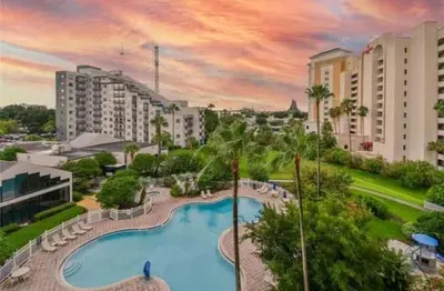a view of a swimming pool in a resort at Remodeled 2BD/2BA Condo mins from Universal Studio in Orlando