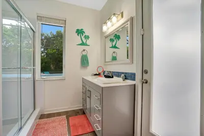 a bathroom with a sink and a shower at Yelleville on Sunset! 4 Miles to Disney in Kissimmee