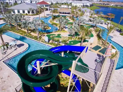 an aerial view of a water slide at a resort at 7 BR Large Pool Game Room @ Storey Lake SL2861 in Kissimmee