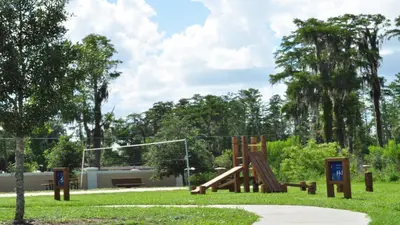 a playground in a park with a slide at Coral Cay - 4 Bed 3 Baths Townhome in Kissimmee