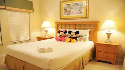 a bedroom with a bed with stuffed animals on it at Coral Cay - 4 Bed 3 Baths Townhome in Kissimmee