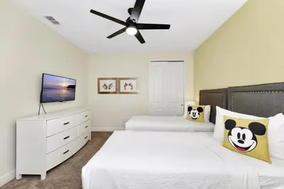 a bedroom with two beds and a ceiling fan at Vibrant Home Near Disney With Private Pool, Game Room And Waterpark & Resort Access At Encore Resorts Reunion - 7572Mr in Kissimmee