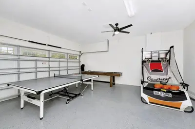 a ping pong room with a ping pong table in it at Vibrant Home Near Disney With Private Pool, Game Room And Waterpark & Resort Access At Encore Resorts Reunion - 7572Mr in Kissimmee