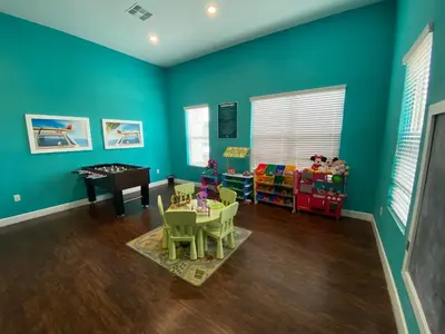 a room with blue walls and a table and chairs at Lovely and Cozy Townhome Near Disney Parks in Kissimmee