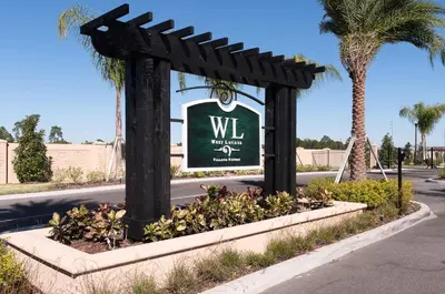 a sign for the w villa with palm trees at Lovely and Cozy Townhome Near Disney Parks in Kissimmee