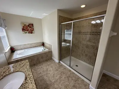 a bathroom with a shower and a sink at Paradise Palms Resort - 6 Bed 5 Baths Villa in Kissimmee