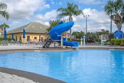 a slide in a pool at a resort at New listing 5 mi from Disney,Free Arcades, HeatedPool & Water park in Kissimmee